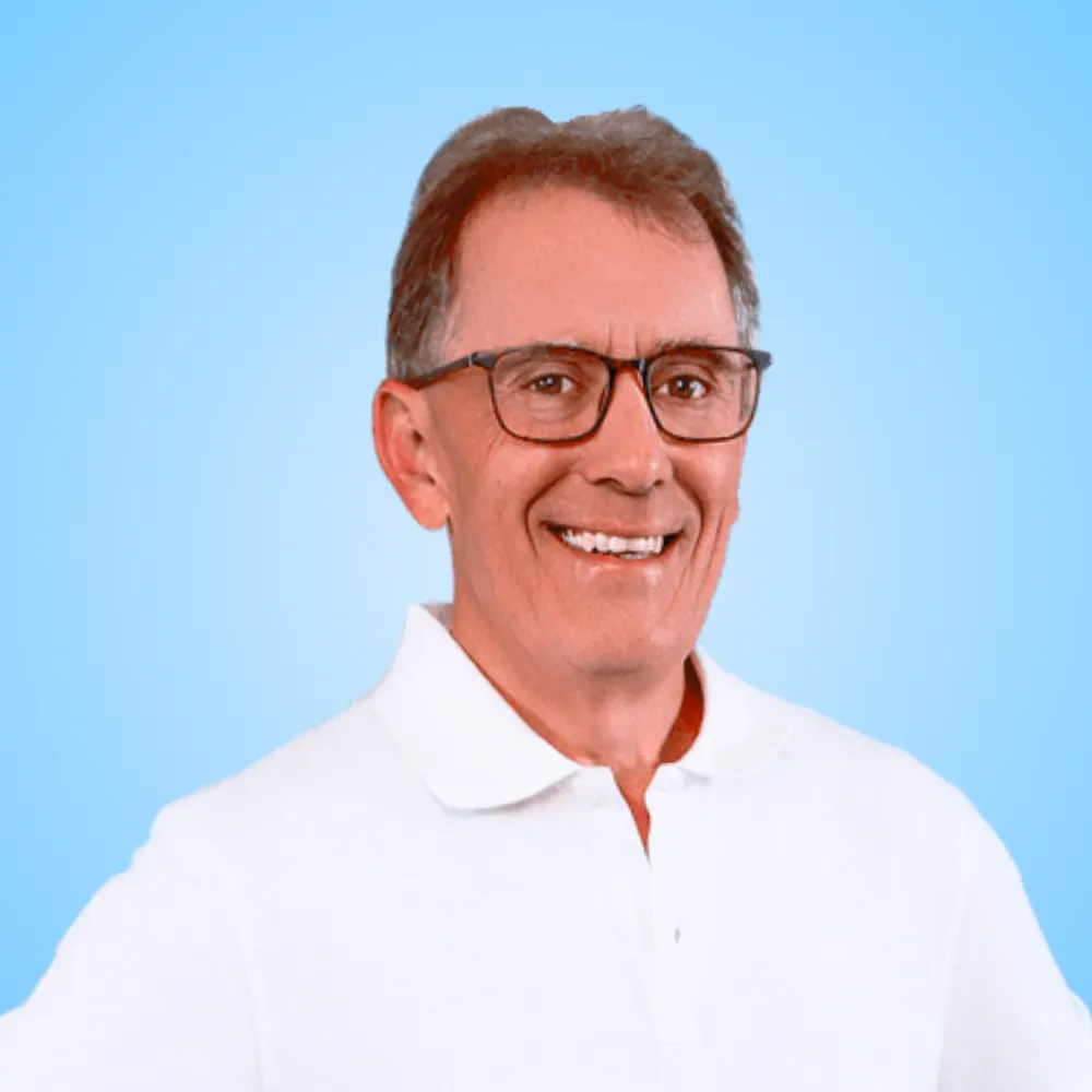 Gregory Mohr smiling in a white polo shirt